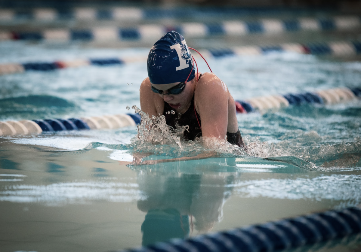 Taryn Ripley (8) swims the 100 yard breaststroke. 